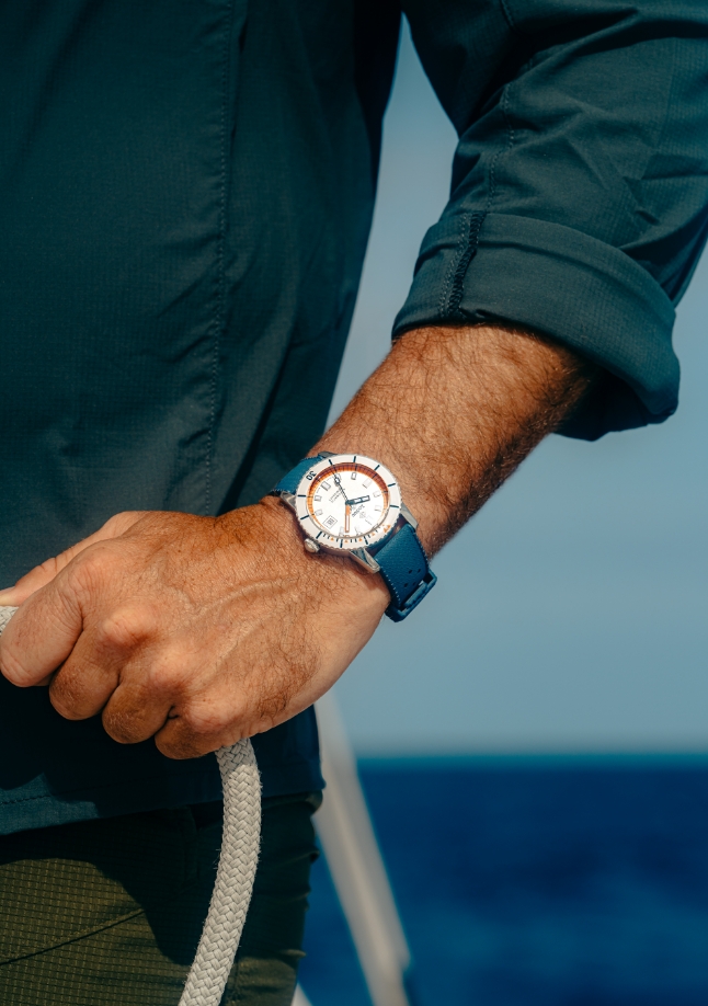 Watch on a man's arm.