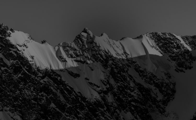 Black and white image of mountain peaks.