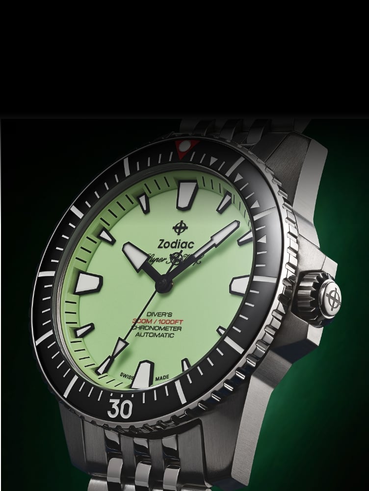 Detail shot of a Super Sea Wolf Pro-Diver watch featuring a pistachio dial, black bezel and five-link stainless steel bracelet