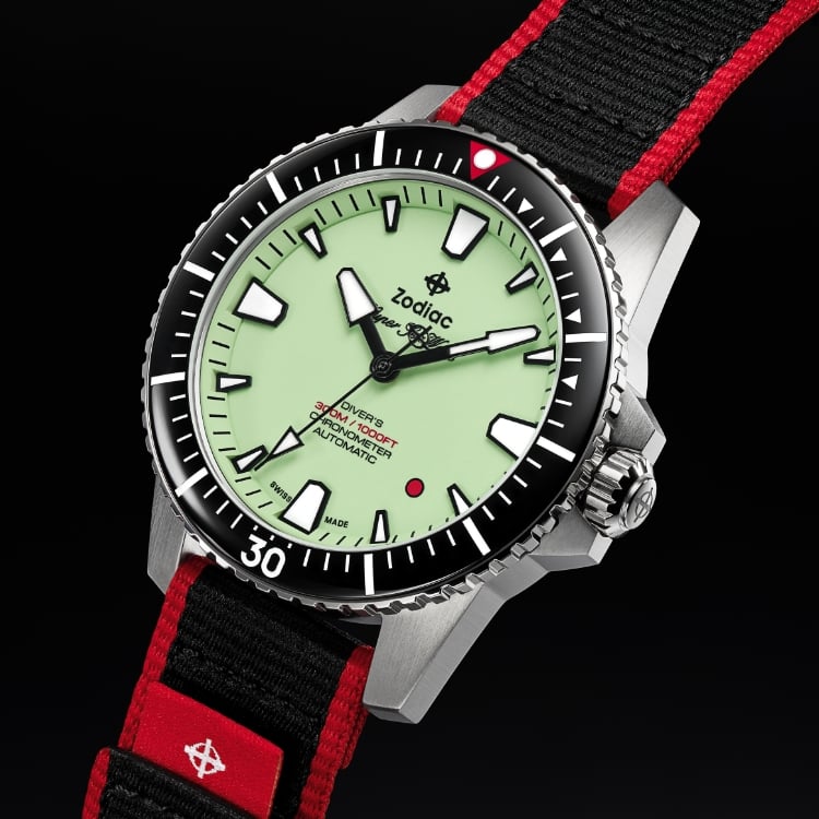 Detail shot of the Super Sea Wolf Pro-Diver Zodiac x RedBar watch featuring a pistachio dial, black bezel and red and black strap