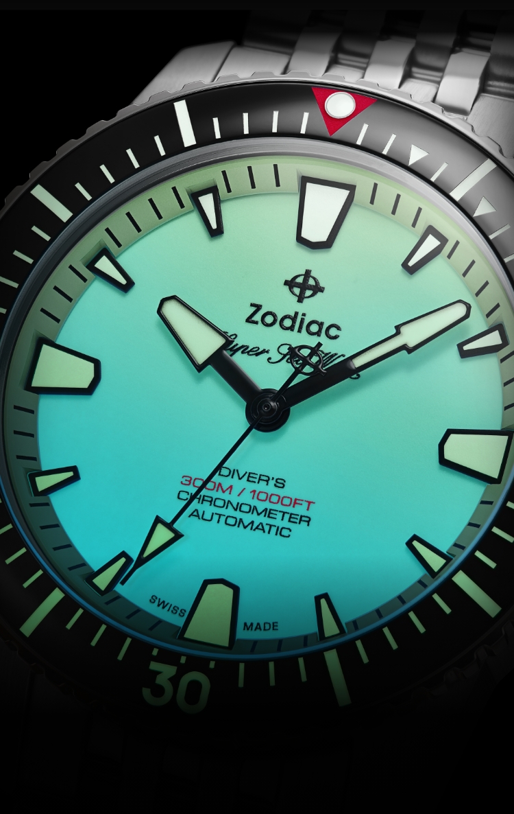 Detail shot of a Super Sea Wolf Pro-Diver watch with focus on its illuminated, fully-lume Super-LumiNova® dial
