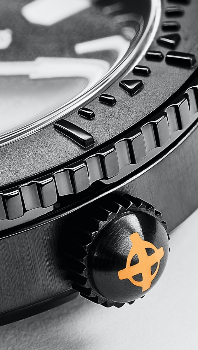 A close up of a DLC-plated watch case and crown A close up of a DLC-plated watch case and crown