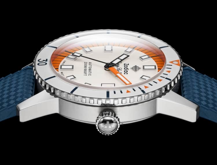 Detail shot of a Super Sea Wolf Compression watch with a stainless steel case, orange and white dial, and blue rubber strap