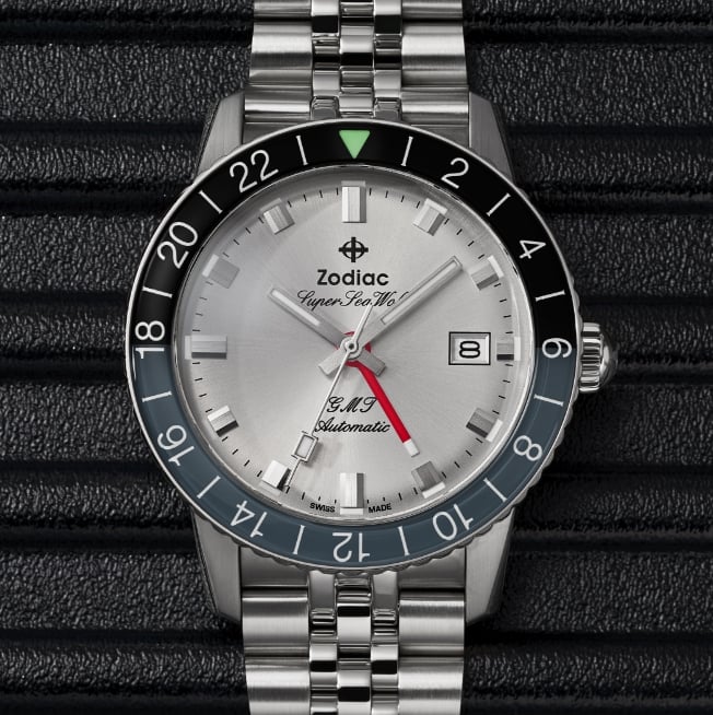 Close up shot of a Super Sea Wolf GMT watch with a gray and black split, rotating bezel.