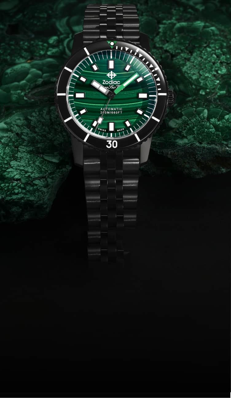 Detail shot of a Super Sea Wolf Compression Diver watch featuring a genuine malachite dial