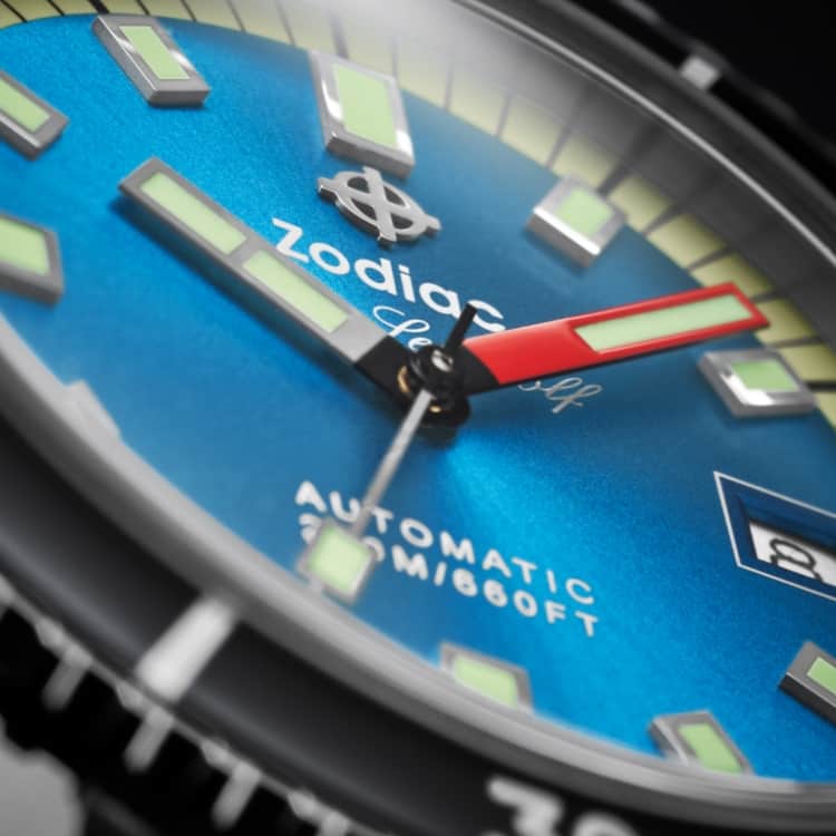 Close up of a Super Sea Wolf Compression Diver watch with a black bezel, blue sunray dial, and Super-LumiNova® hands and markers