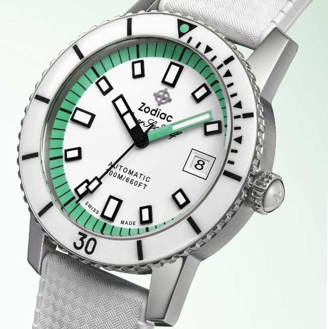 Detail shot of a Super Sea Wolf Compression Diver watch featuring a white and spearmint dial with a white tropic rubber strap
