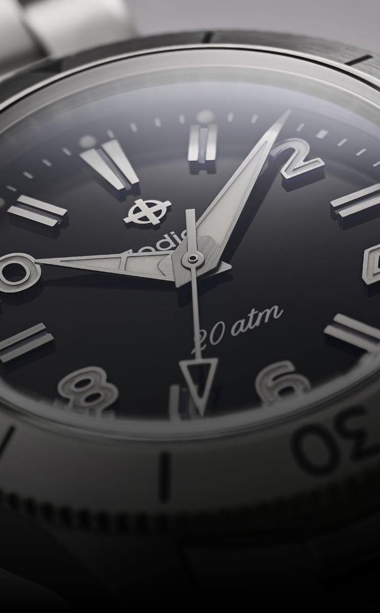Close up of the Super Sea Wolf Ref. 691 focusing on the black dial, numeral markers and dauphine-style hands.