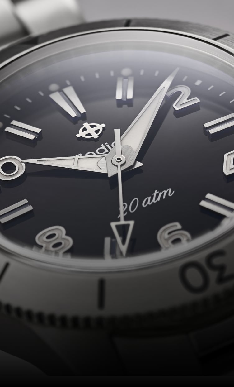 Close-up of the Super Sea Wolf Ref. 691 focusing on the black dial, numeral markers and dauphine-style hands.