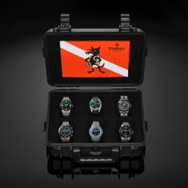 Zodiac watch box on a black background.