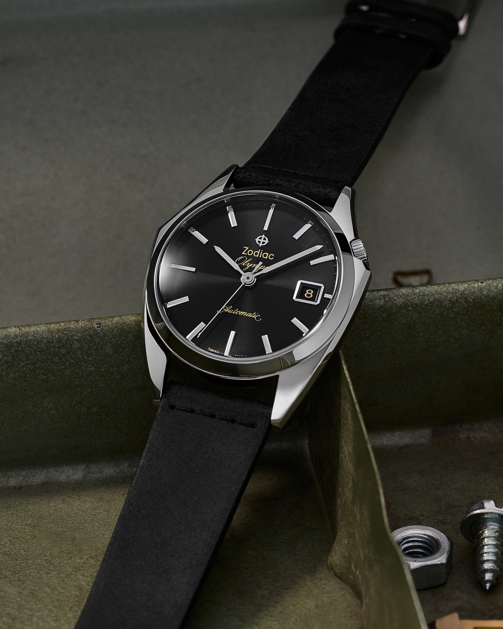 An Olympos with a black leather strap