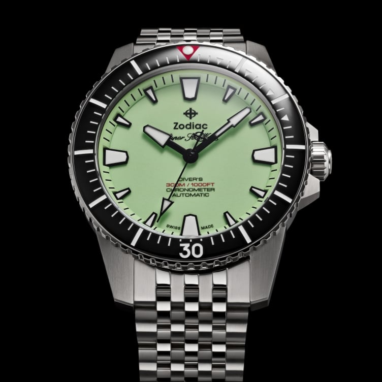 Detail shot of a Super Sea Wolf Pro-Diver watch featuring a pistachio dial, black bezel and five-link stainless steel bracelet.