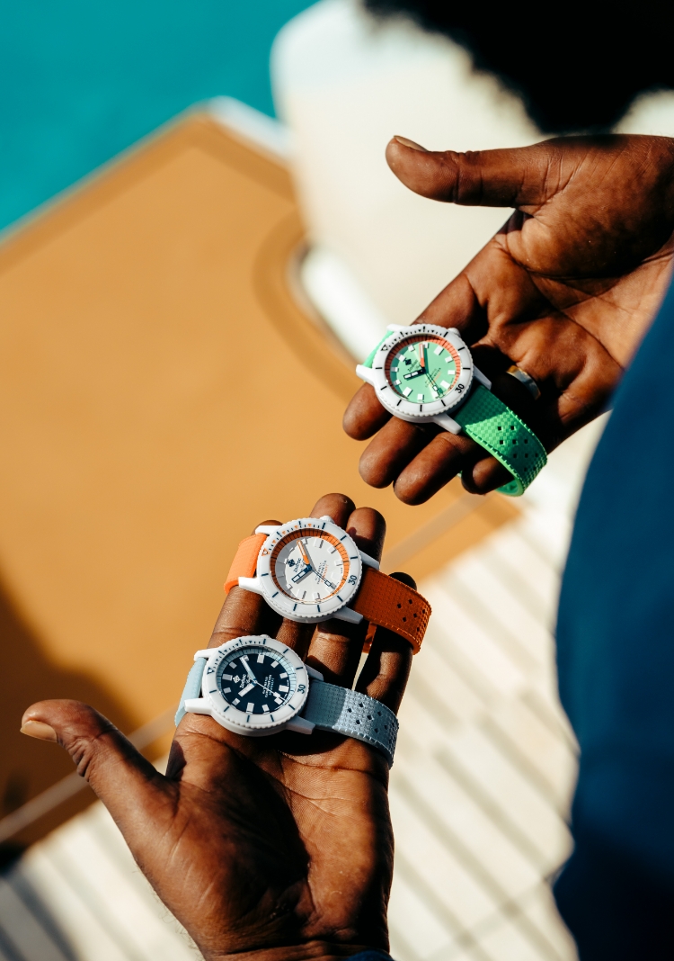 Man holding Zodiac watches.